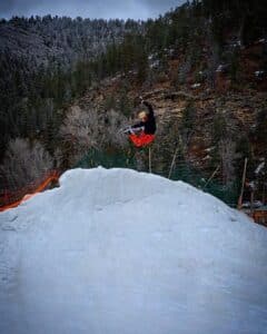 Guy doing a trick on a snowboard