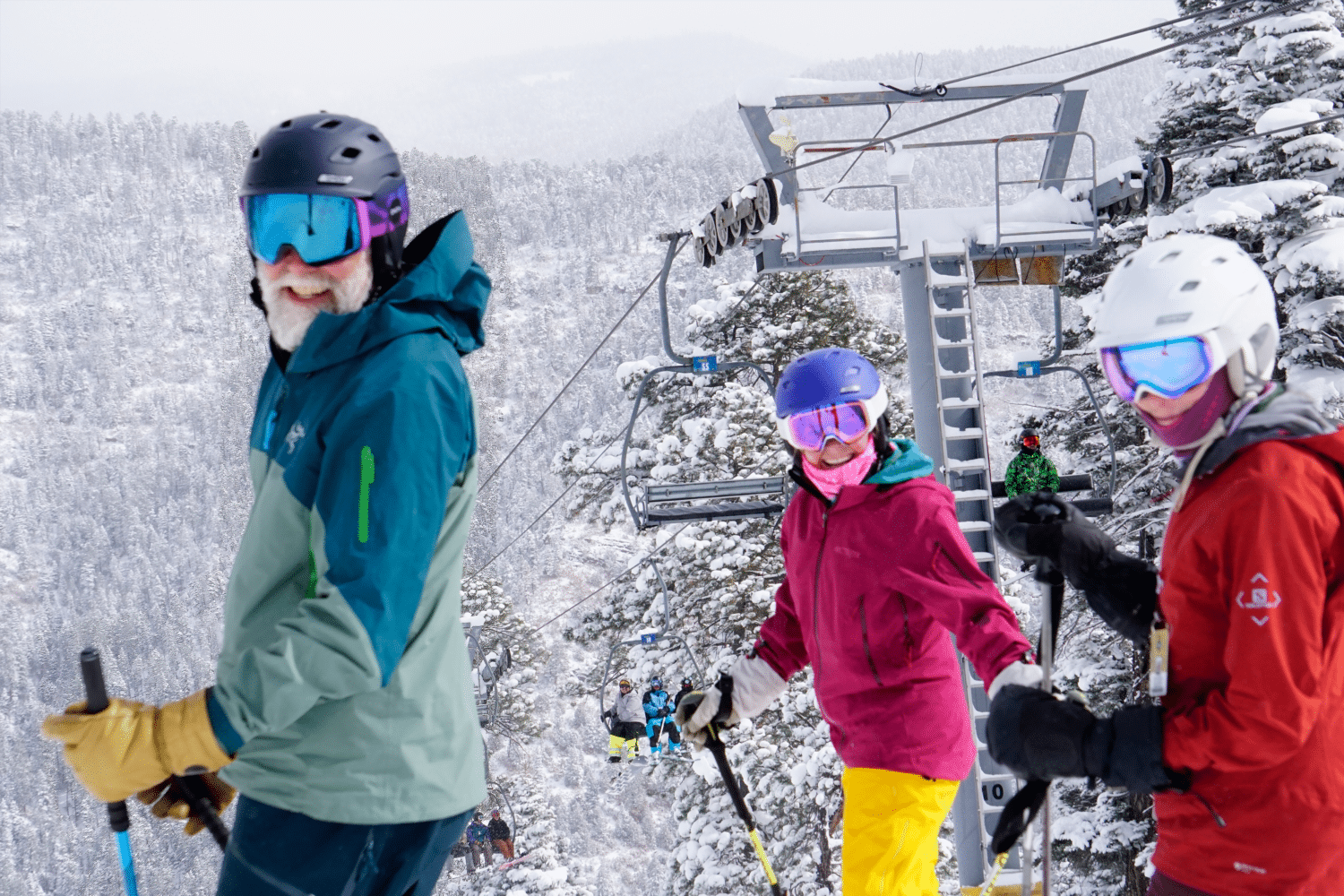 colorful skiers at sipapu